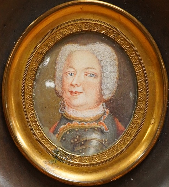 Georgian school, portrait miniature of a gentleman in armour, oval watercolour on card, framed, 2.7 x 2.3cm